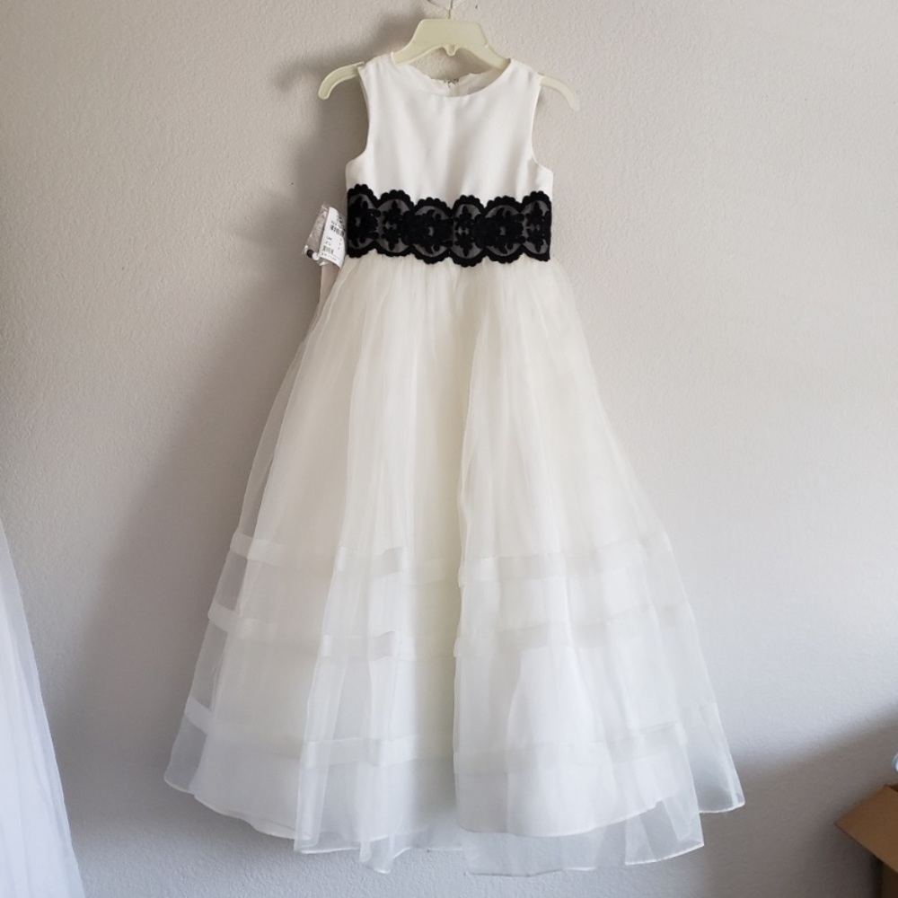 Ivory with black lace belt attached. Beautiful like new condition.